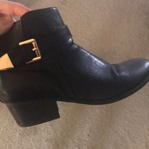 Black booties with gold hardware